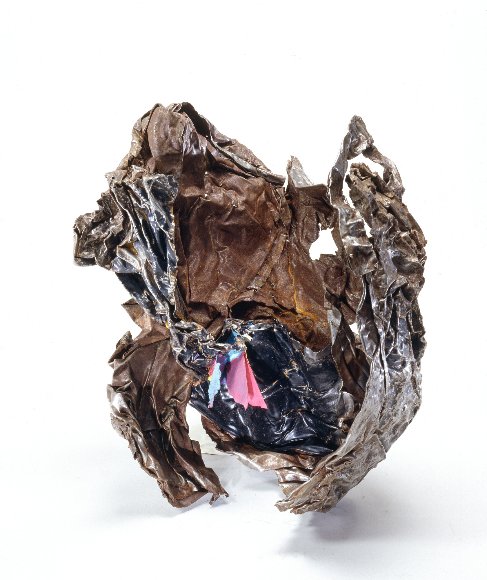 Figure 33. File Cabinet from a Ben & Jerry's ice-cream shop under the WTC complex. The paper retained its color, indicating this file cabinet did not shrivel due to conventional heat. Fused filing cabinet artifact showing paper documents embedded in resolidified ferrous metal matrix, with paper fibers visible and legible without carbonization